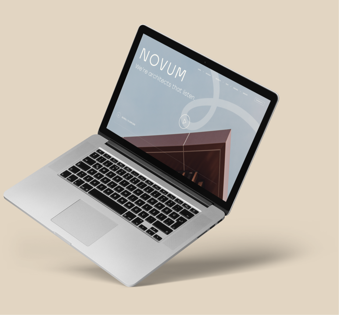 Laptop displaying Novum Architects website.