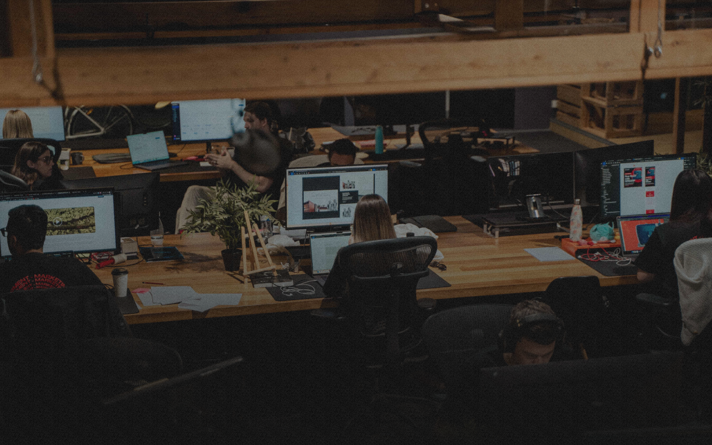 People working at desks with computers.