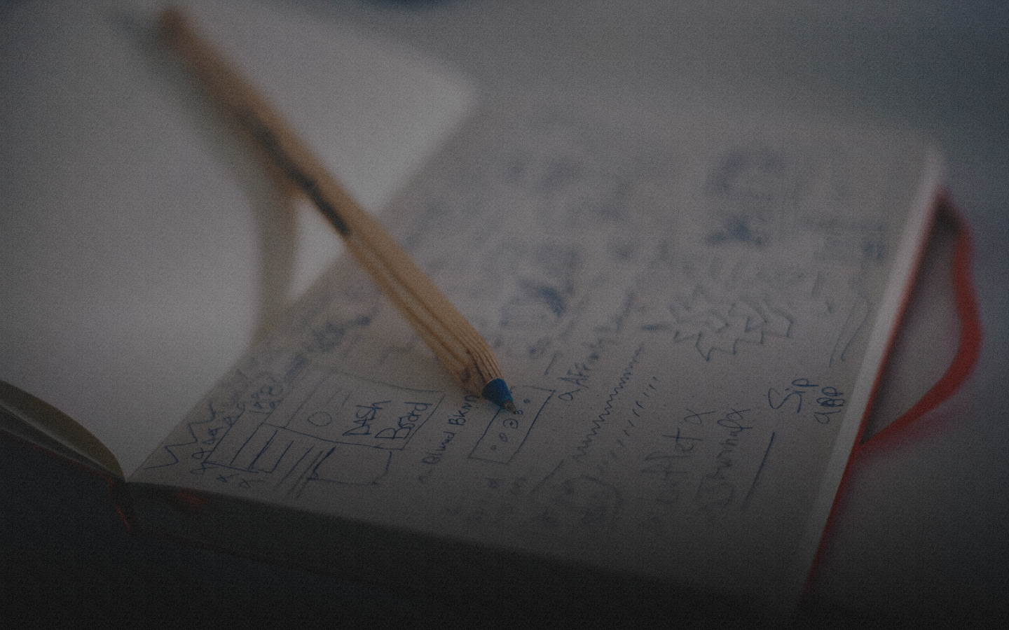 Notebook with pencil and scribbles.